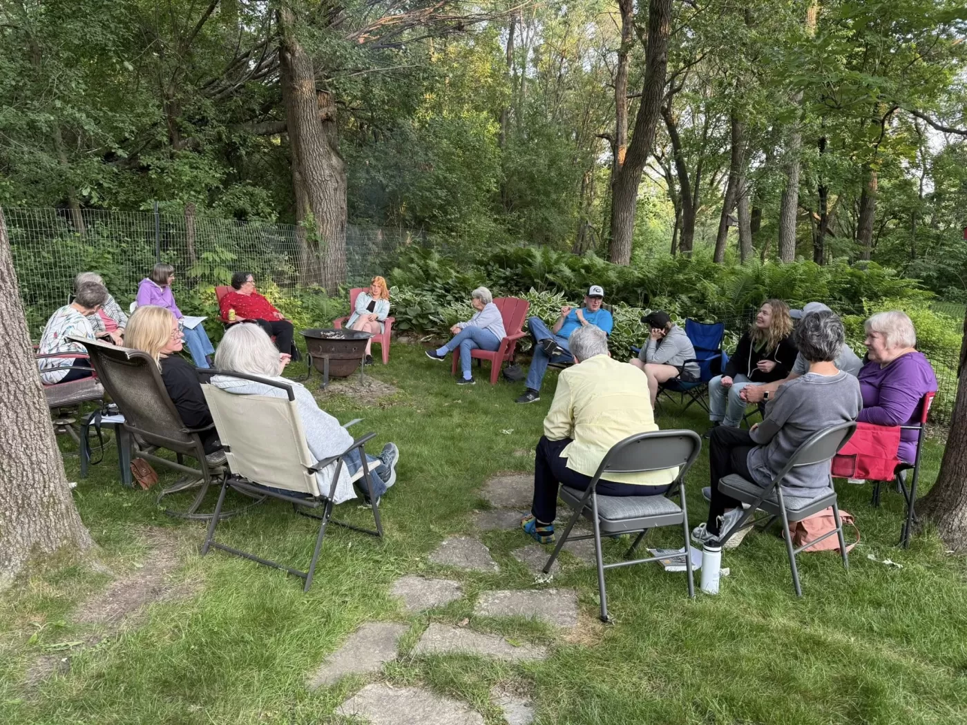 People sitting around a campfire outside